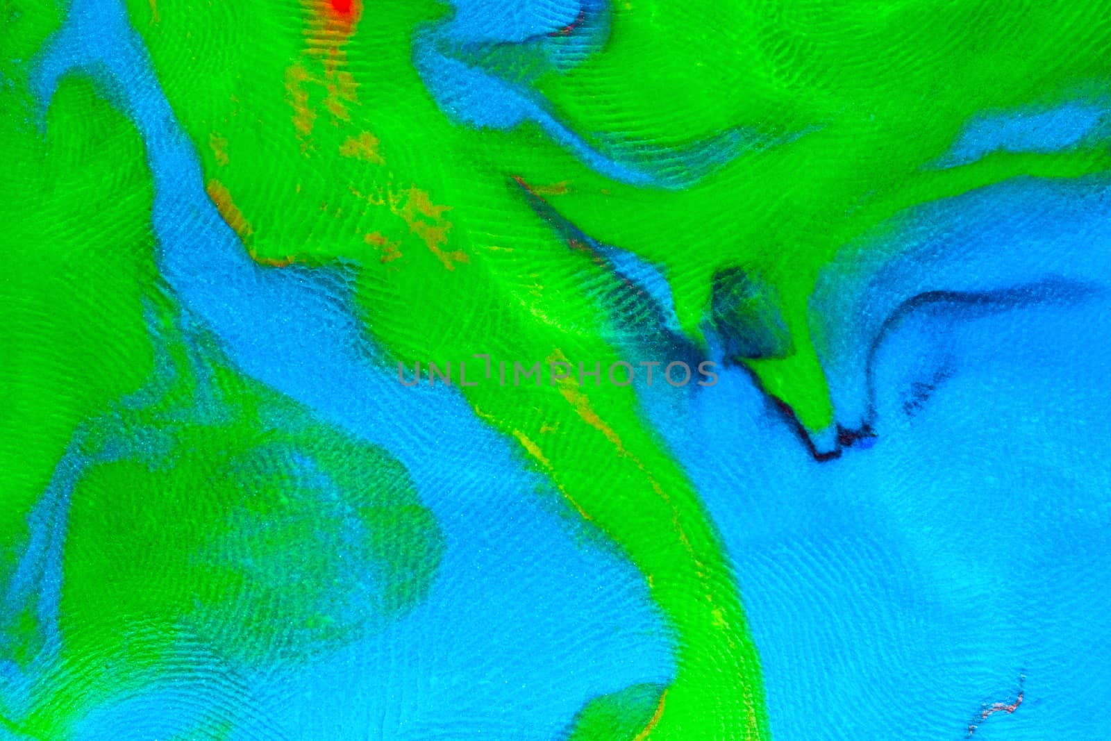 Mixed blue-green flat plastilin texture with distinct finger prints. Small dust particles on bumpy surface.