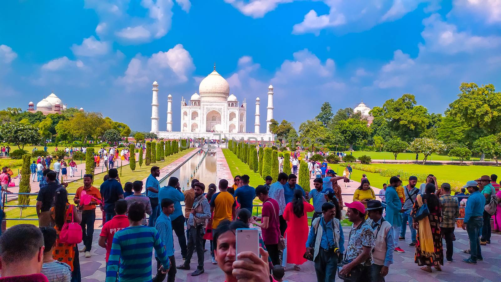Crowed of people and visitors arrive in the Taj Mahal in sunset time. High crowds gathered in Taj Mahal in holiday weekends. Agra India Asia Pacific May 2019