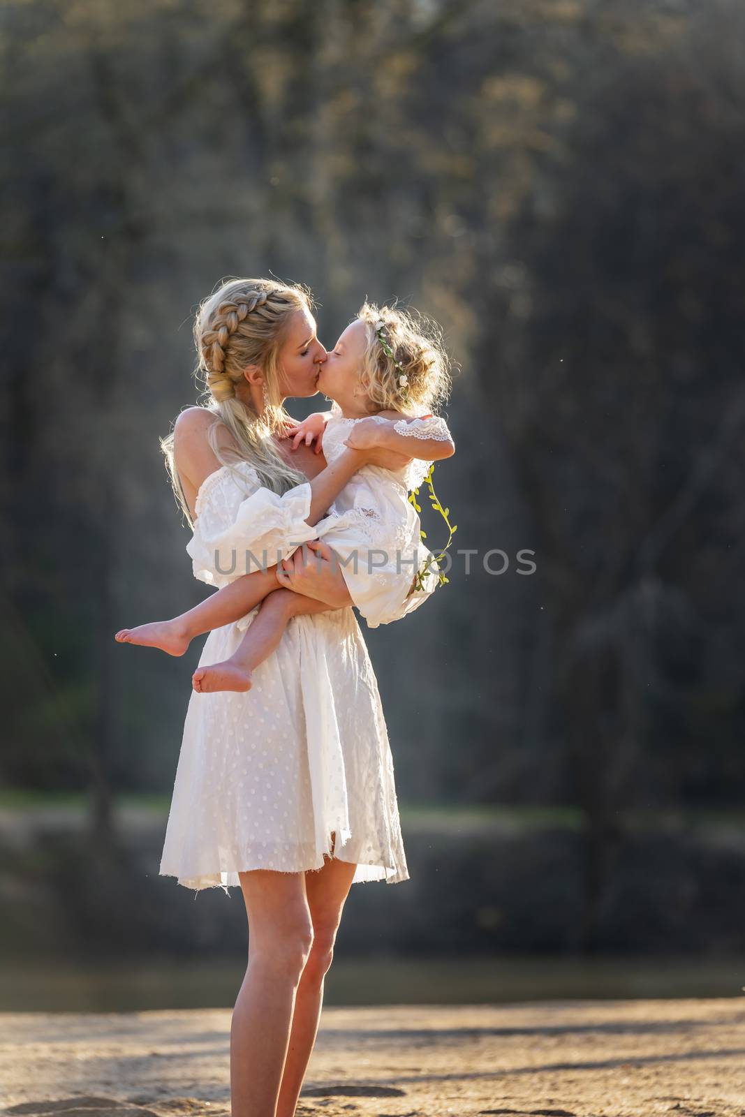 A beautiful young mother and her daughter enjoy the spring weather