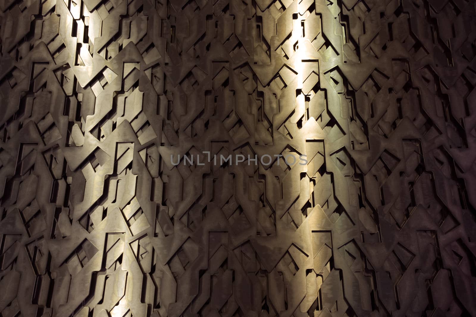 Light glow on grill pattern. Dark grainy industrial abstract background.