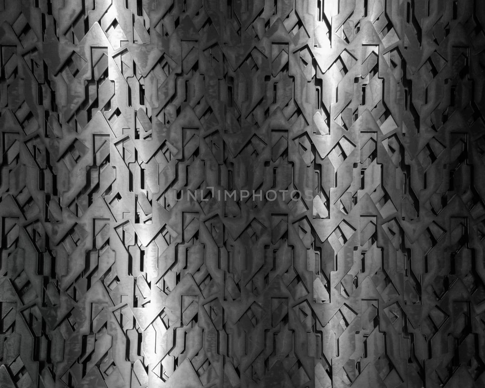 Light glow on grill pattern. Dark grainy industrial abstract background.