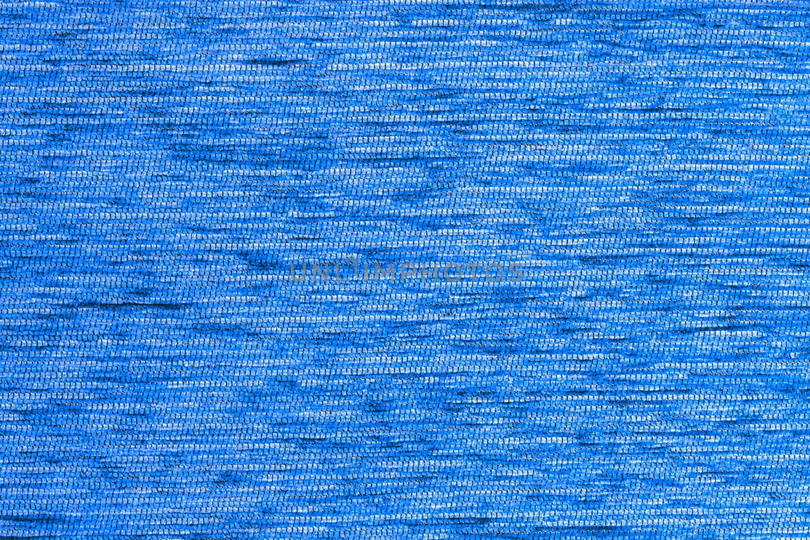 Blue flat short hard fluff dense fabric background, close up without any blurring
