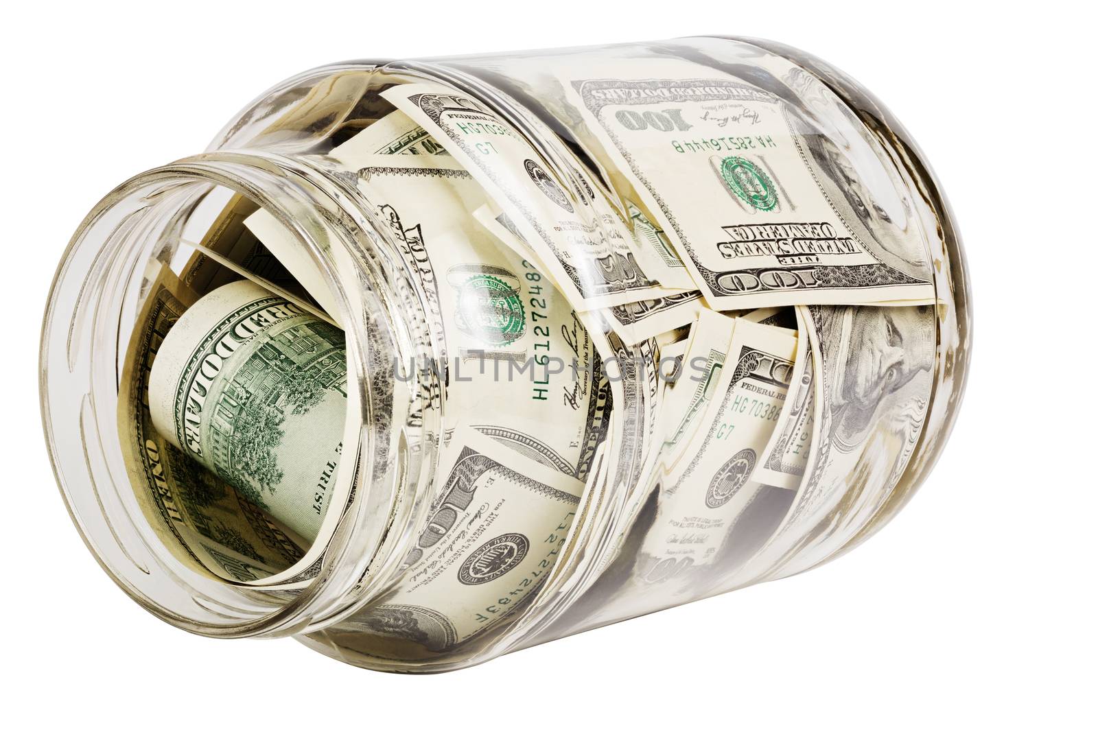 glass jar full of hundred us dollar banknotes laying on side - isolated on white background