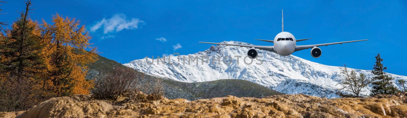 Airplane frying over the Snow Mountain background by Surasak