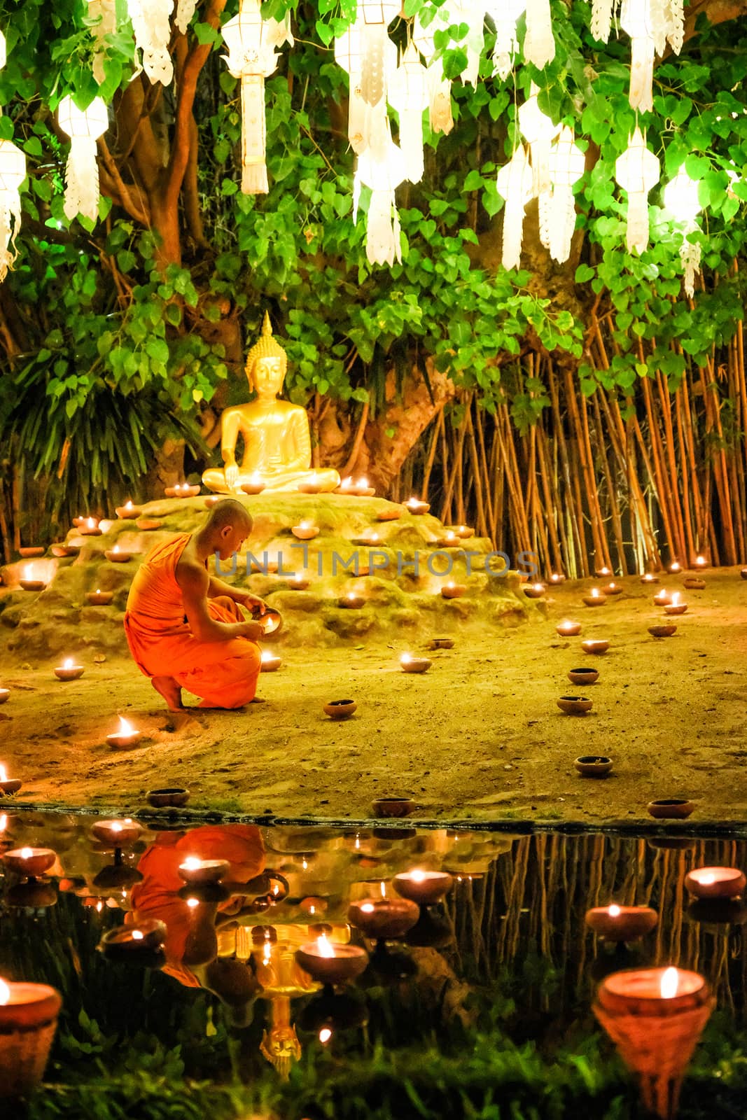 CHIANG MAI THAILAND - NOVEMBER 14 : Buddhist monks praying for the Loy Krathong festival at Wat Phan Tao on November 14, 2016 in Chiang Mai, Thailand.