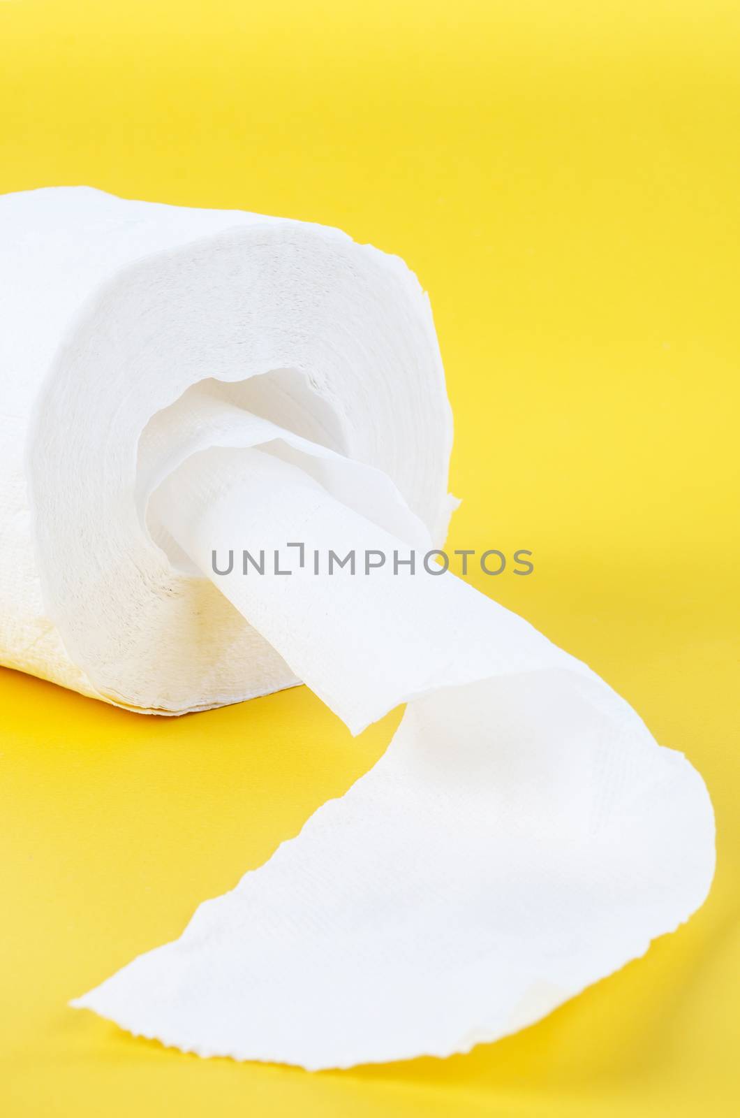 Tissue paper rolls on the yellow background.