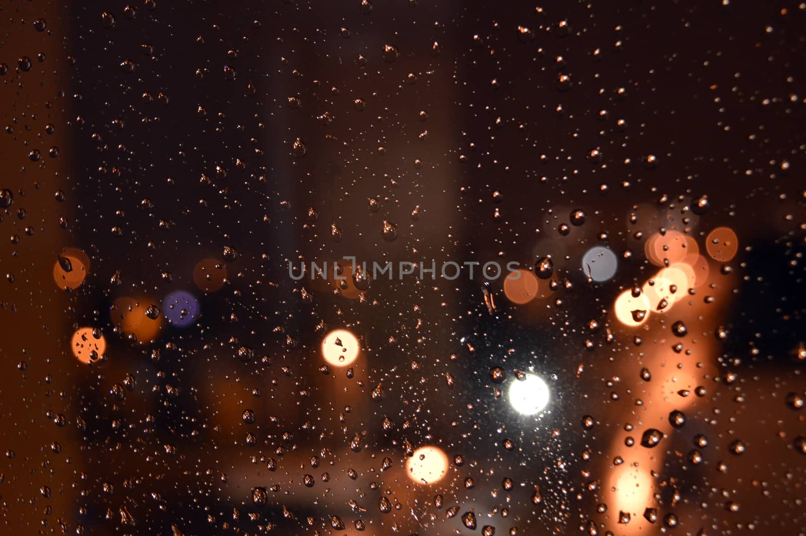 Rain drops on night window by sergpet