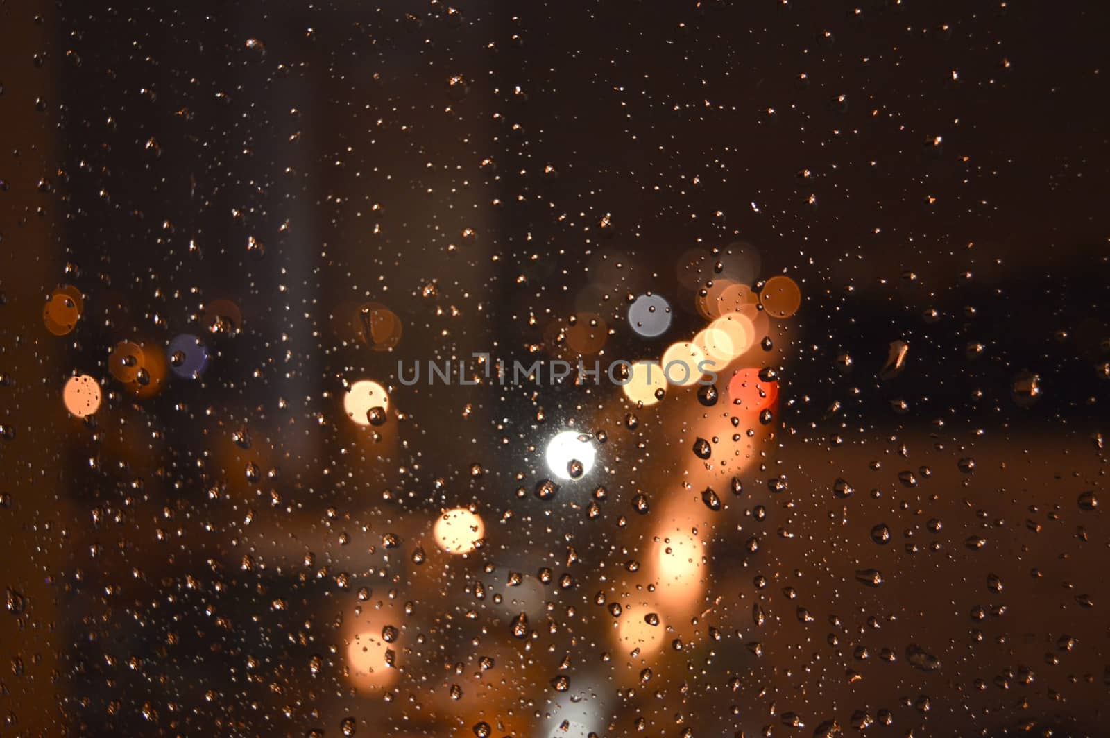 Rain drops on night window, shallow dof