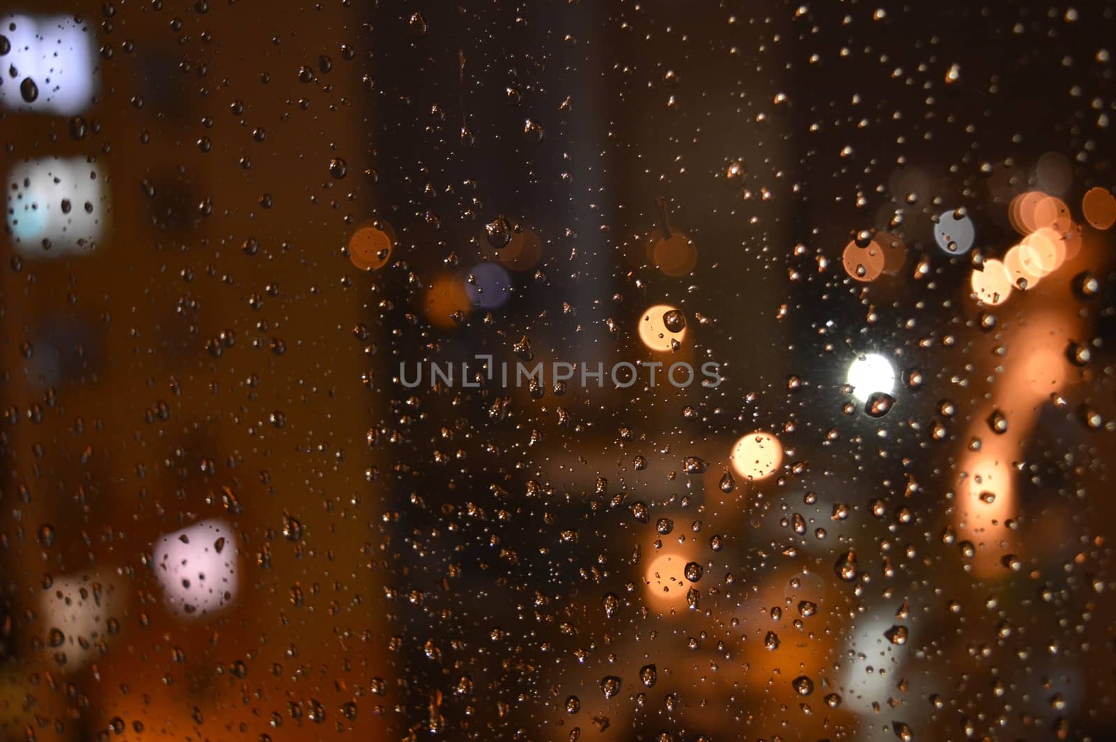 Rain drops on night window, shallow dof