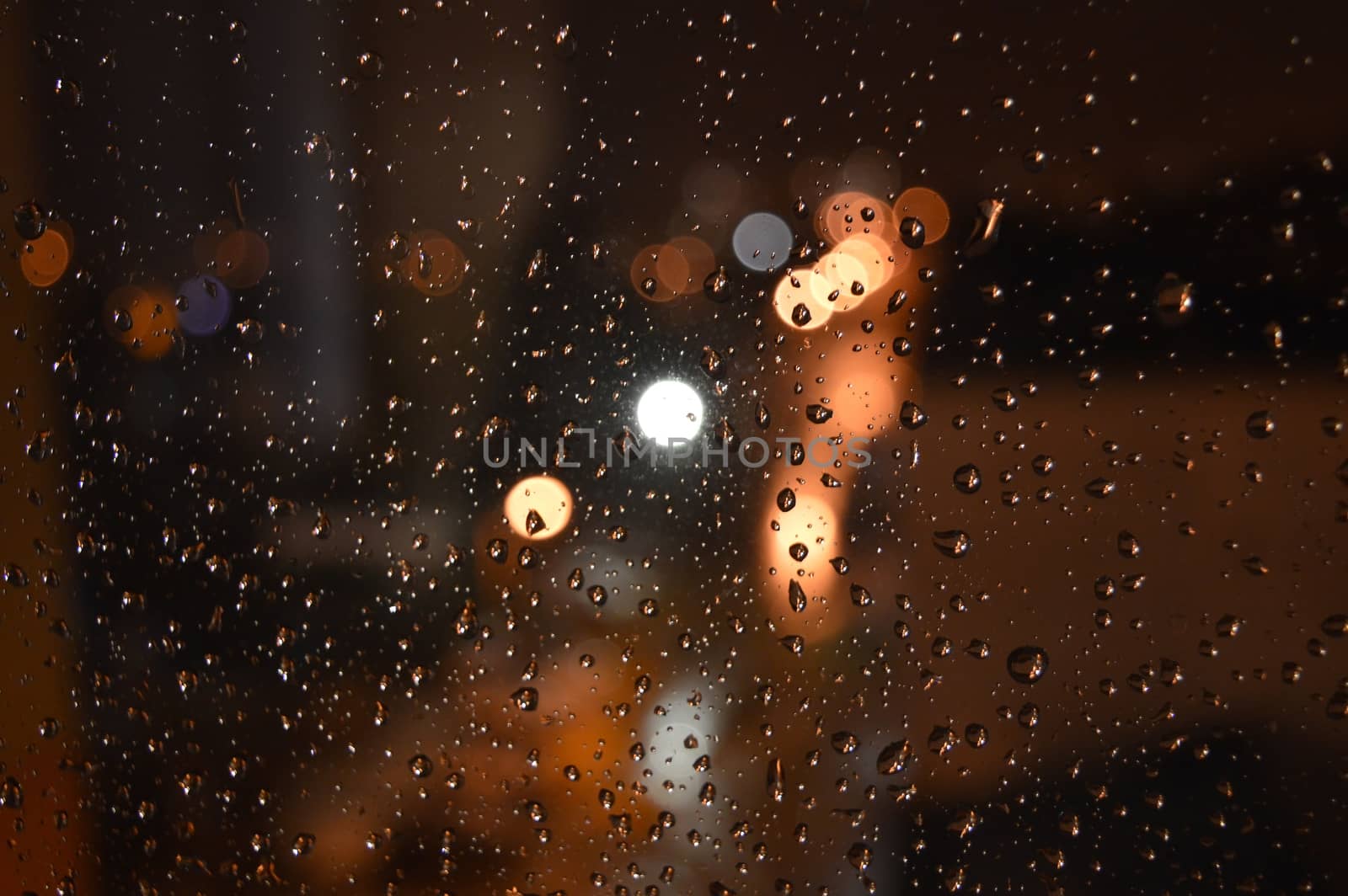 Rain drops on night window, shallow dof