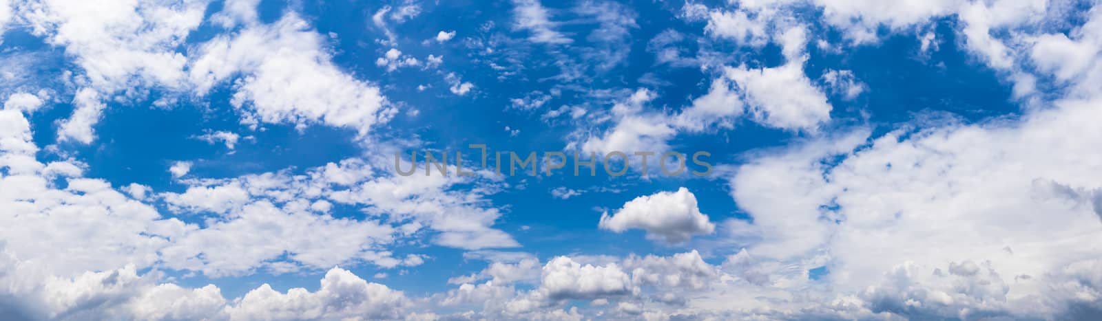 Panoramic white fluffy clouds in the blue sky, Fantastic soft white clouds against blue sky