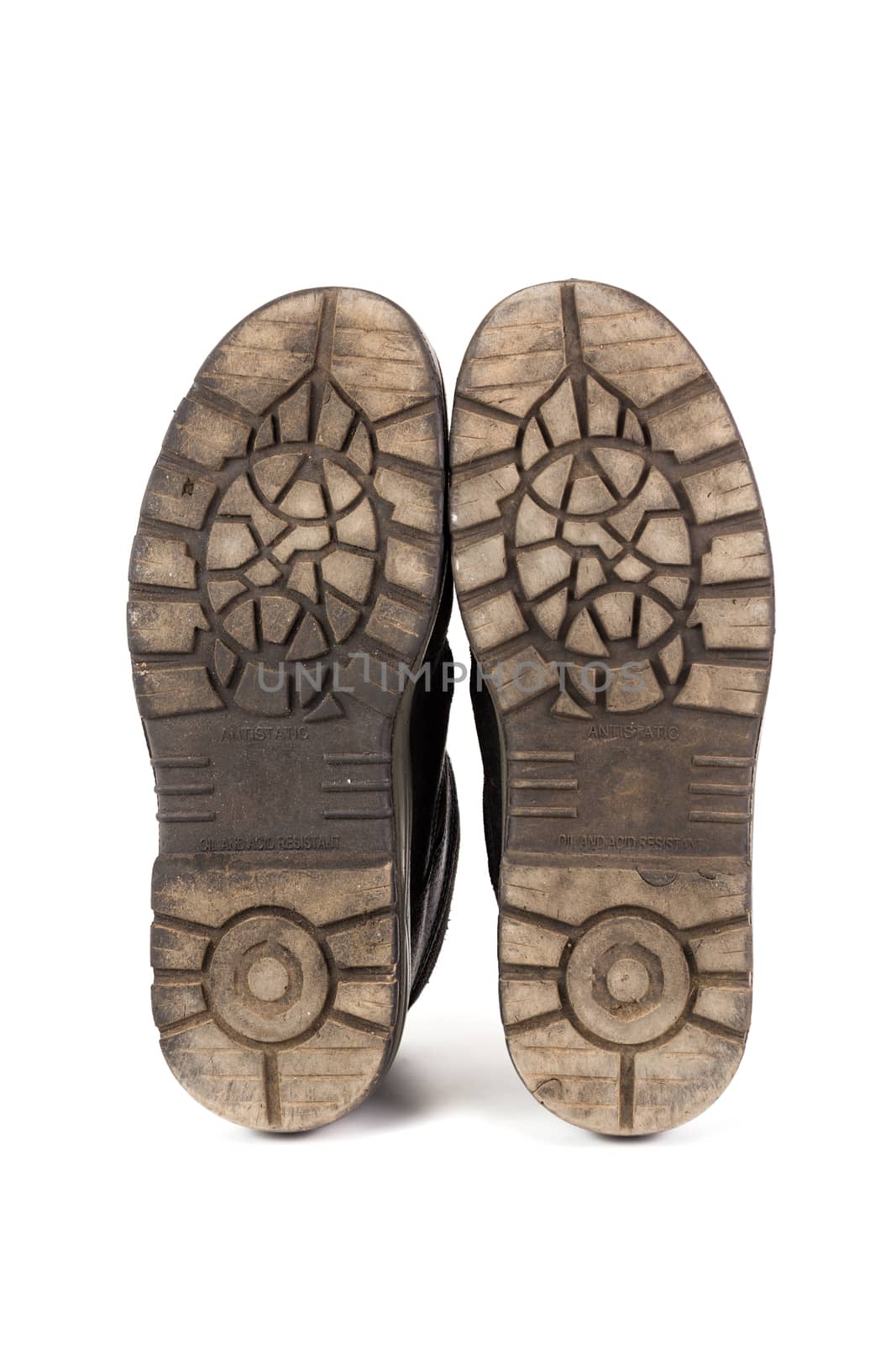 Sole bottom of a pair workboots with acid and oil resistance ability. Isolated on white background
