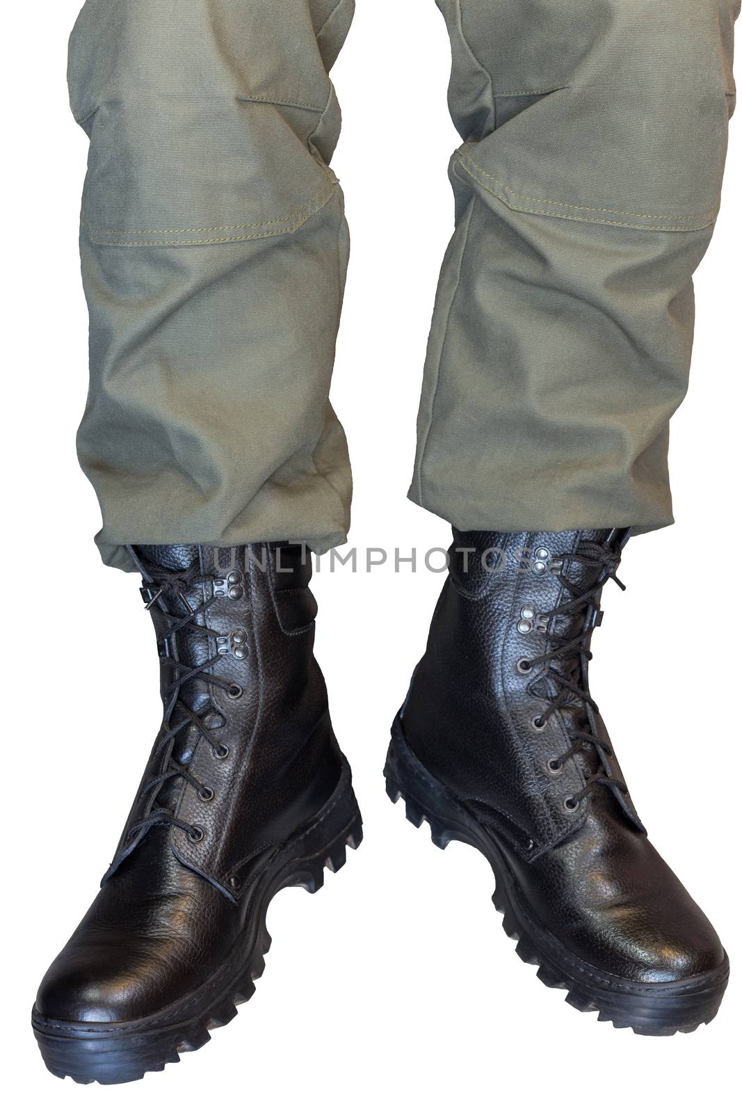 Legs in army khaki pants and military black boots isolated on white background