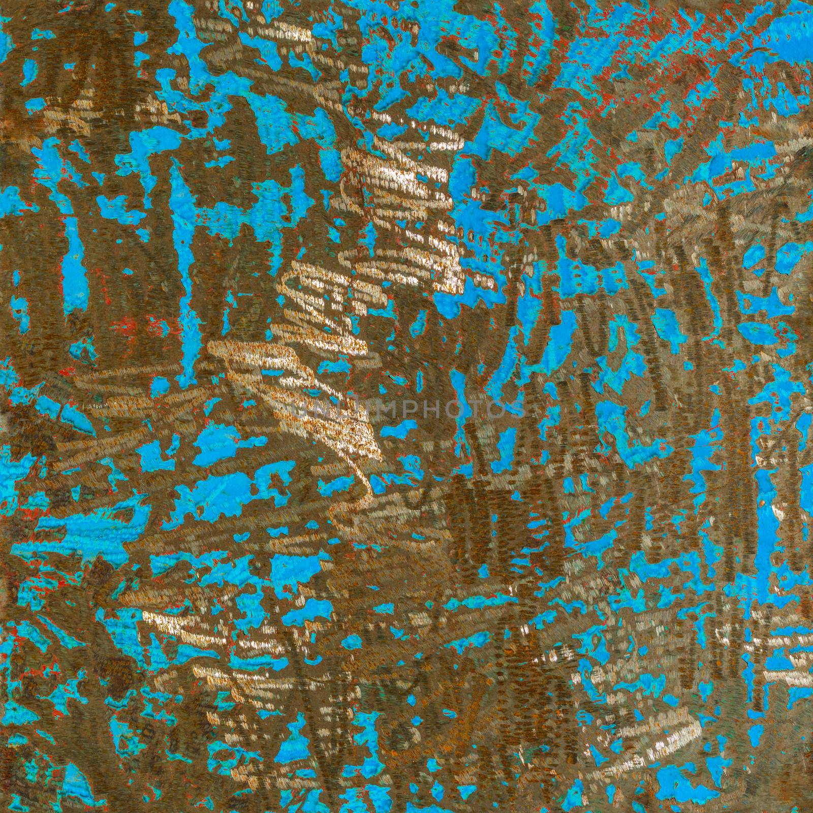 metal texture with remnants of blue paint after removing it with grinder with cutting disk