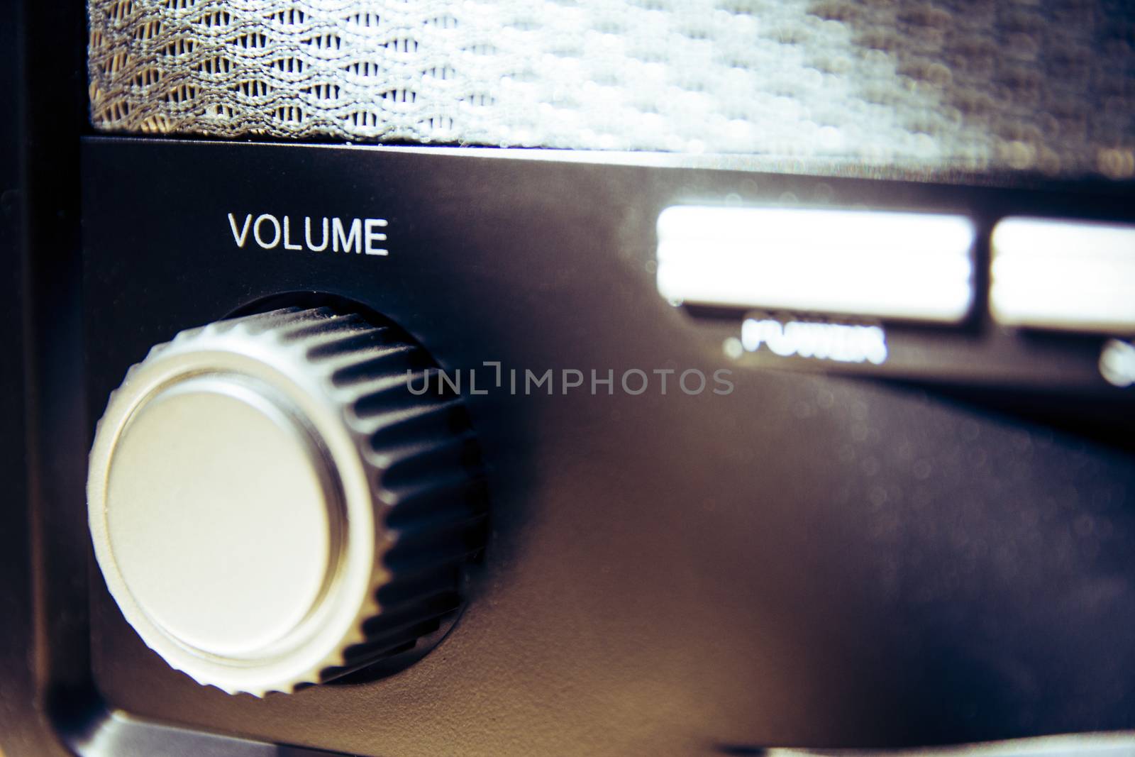 Volume wheel on an old and vintage analog radio. Close-up and detail. Copy Space. by kb79