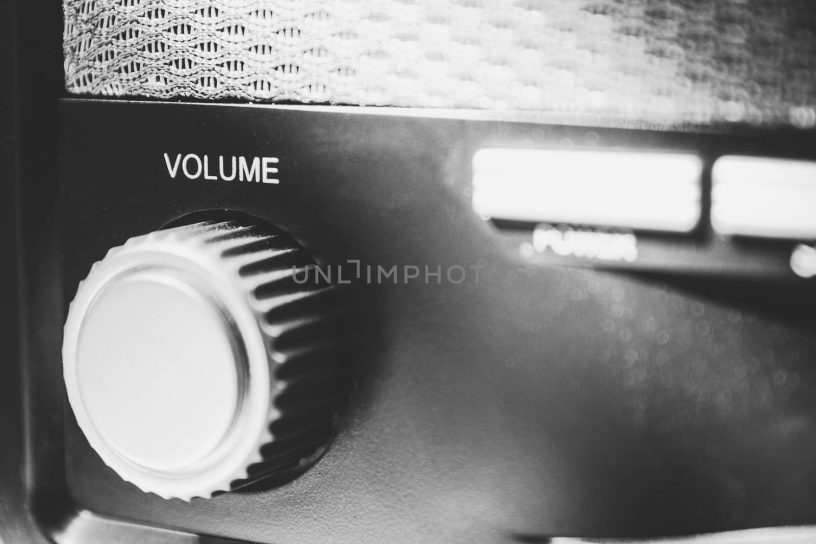 Volume wheel on an old and vintage analog radio. Close-up and detail. Copy Space. by kb79