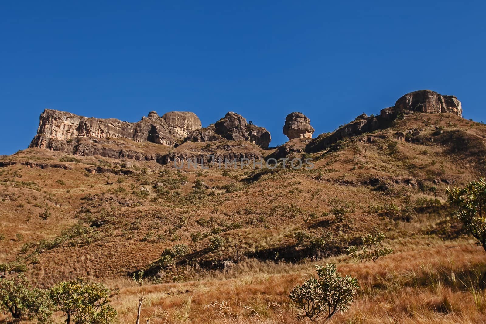 A Drakensberg Mountain Scene.  The formation The Policemans Helmet seen from the Tugela River Valley. Royal Natal National Park. KwaZulu Natal. South Africa
