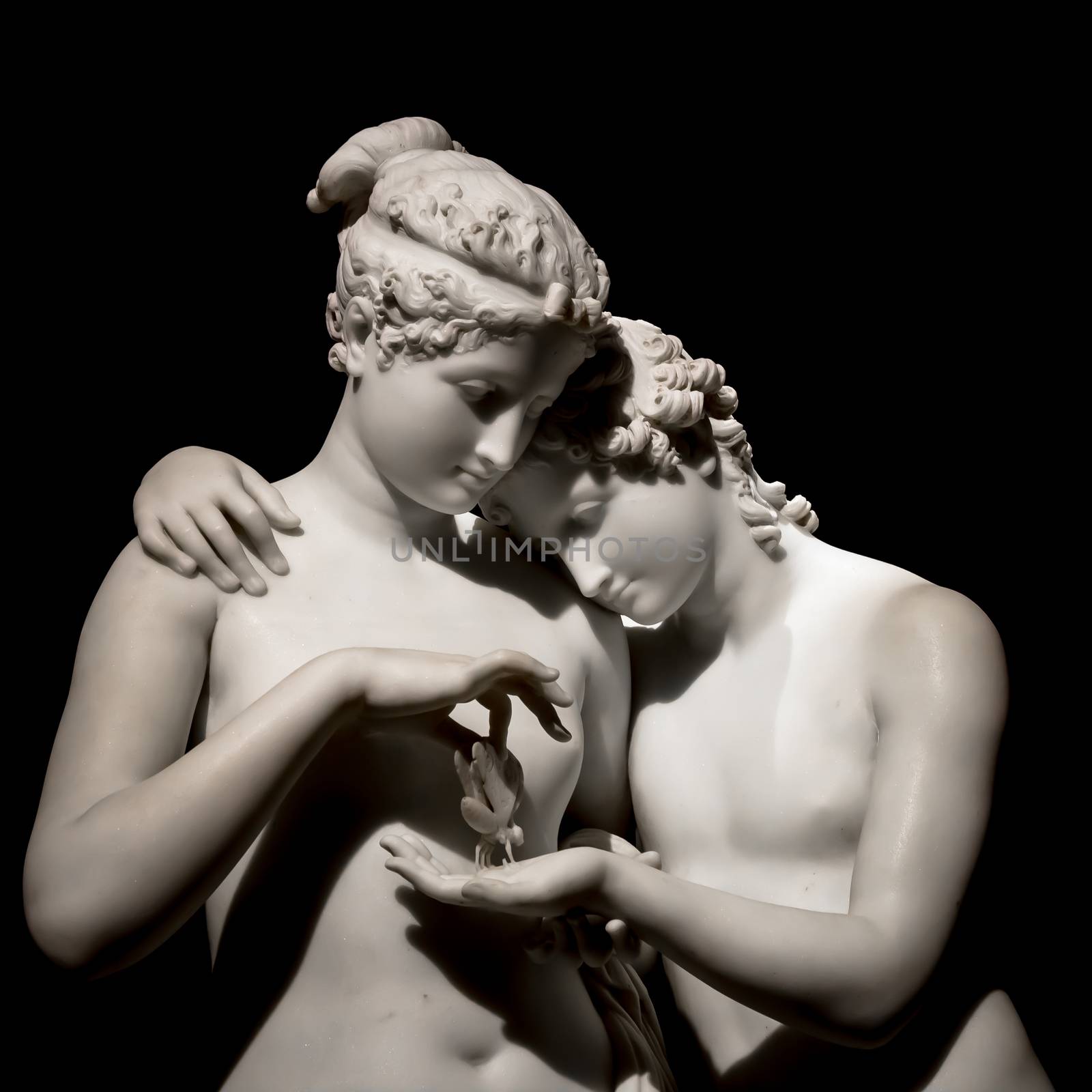 MILAN, ITALY - June 2020. Antonio Canova's masterpiece Cupid and Psyche (Amore e psiche, 1797), symbol of eternal love. Psyche raises Cupid left hand with her own, to place a butterfly on his palm. The butterfly symbolizes her soul, which she offers in all innocence to Cupid.