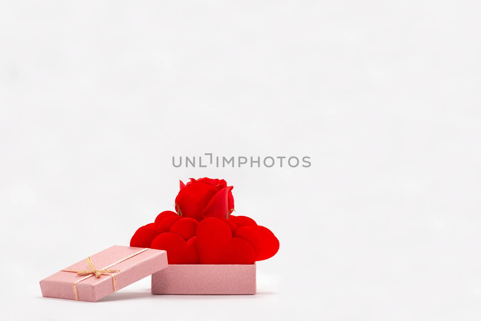 Front View of Rose and Red Hearts in Pink Gift Box. Isolated on White Background. Valentines Day Theme. Symbol of Love and Friendship.