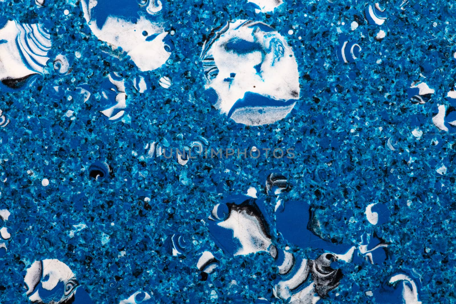Grainy and bubbly blue plastic surface. Top view. by DamantisZ