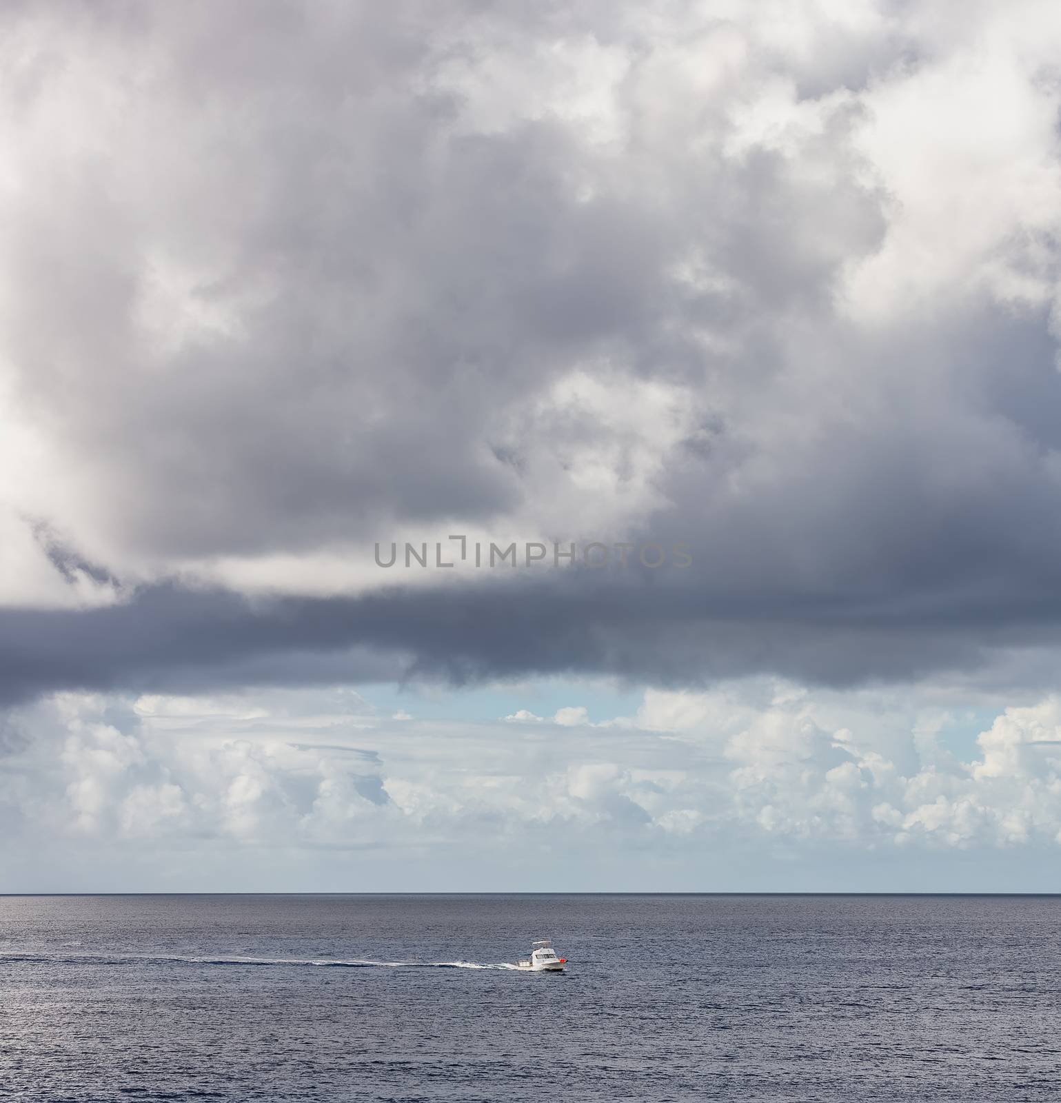Diving boat sailing by the island of Cozumel in Mexico by DamantisZ
