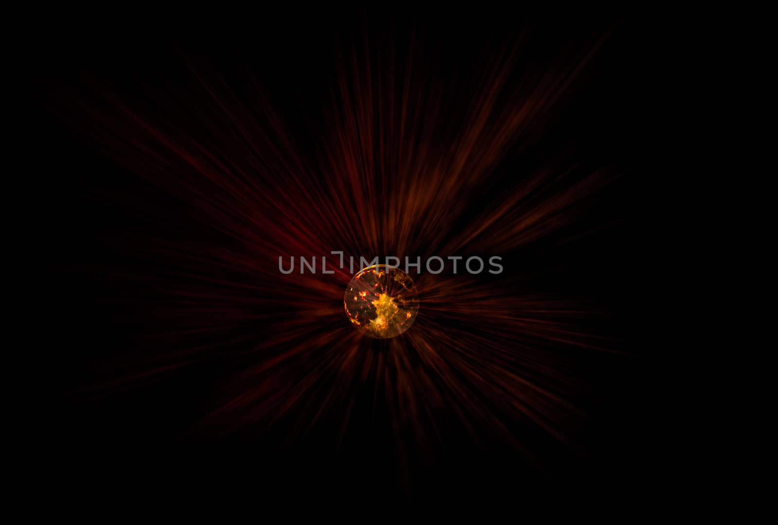 View of the Moon emitting red-and-orange rays on black background. Composite picture