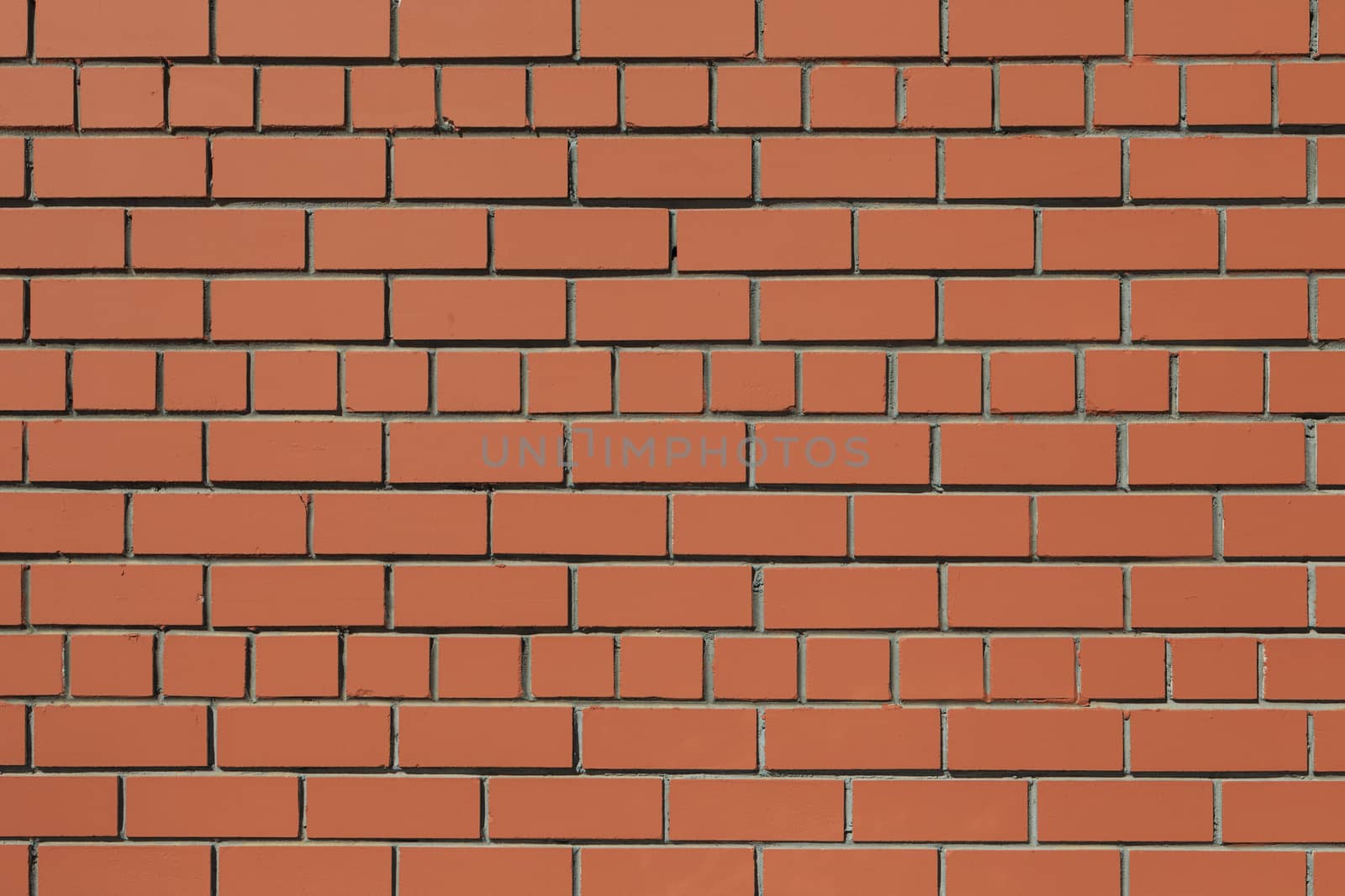 Front full-size view of a flat brown brick wall