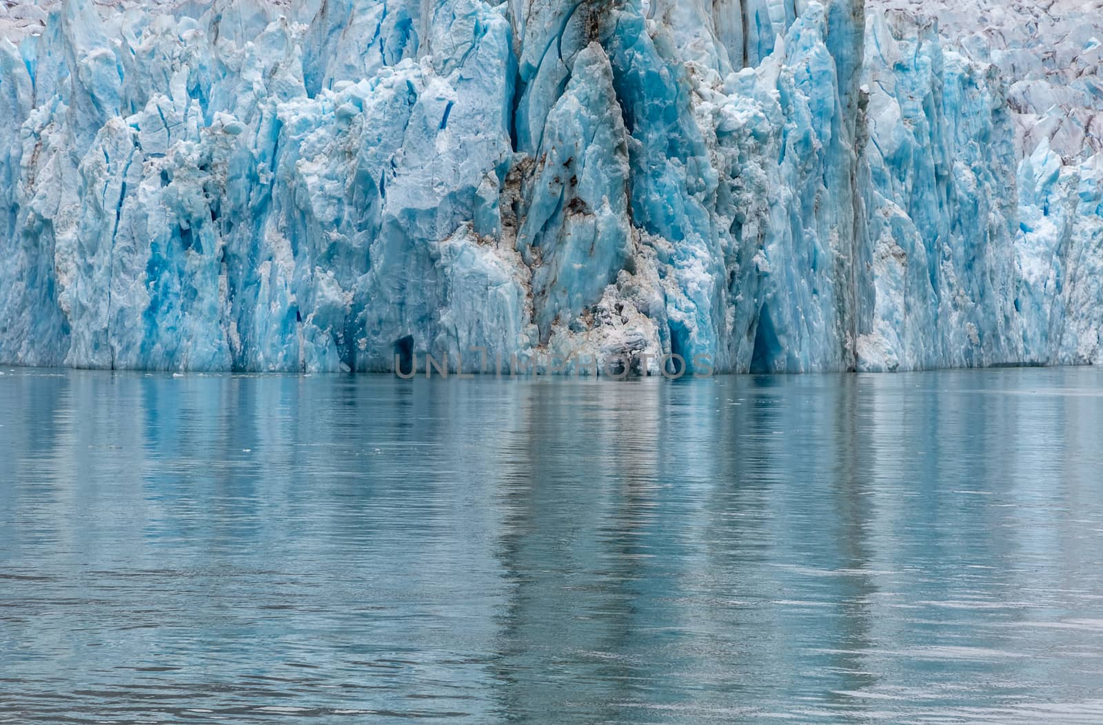 View of a glacier and its reflection in the water