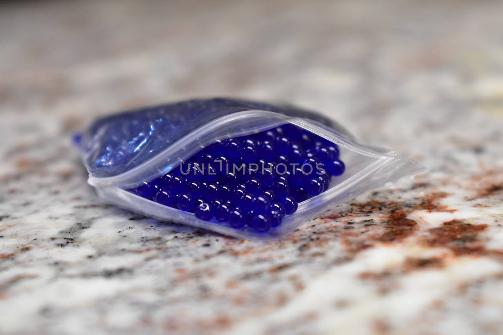 Tiny Blue Orbs in a Plastic Pouch by bju12290