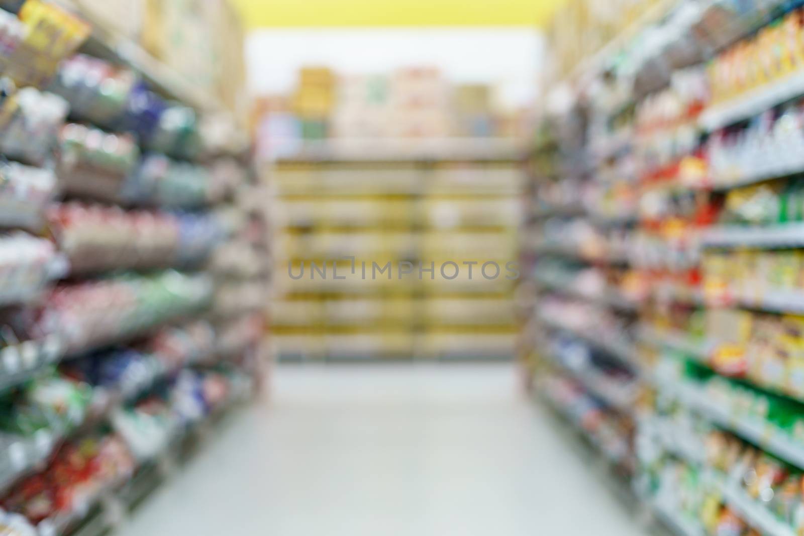 Supermarket blurred background
instant noodles on shelves at grocery.