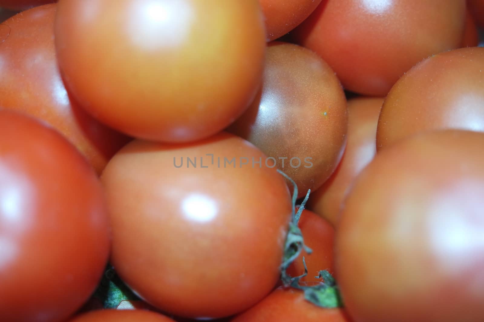 Close-up view of red tomatoes in market for sale. A fruit background for text and advertisements
