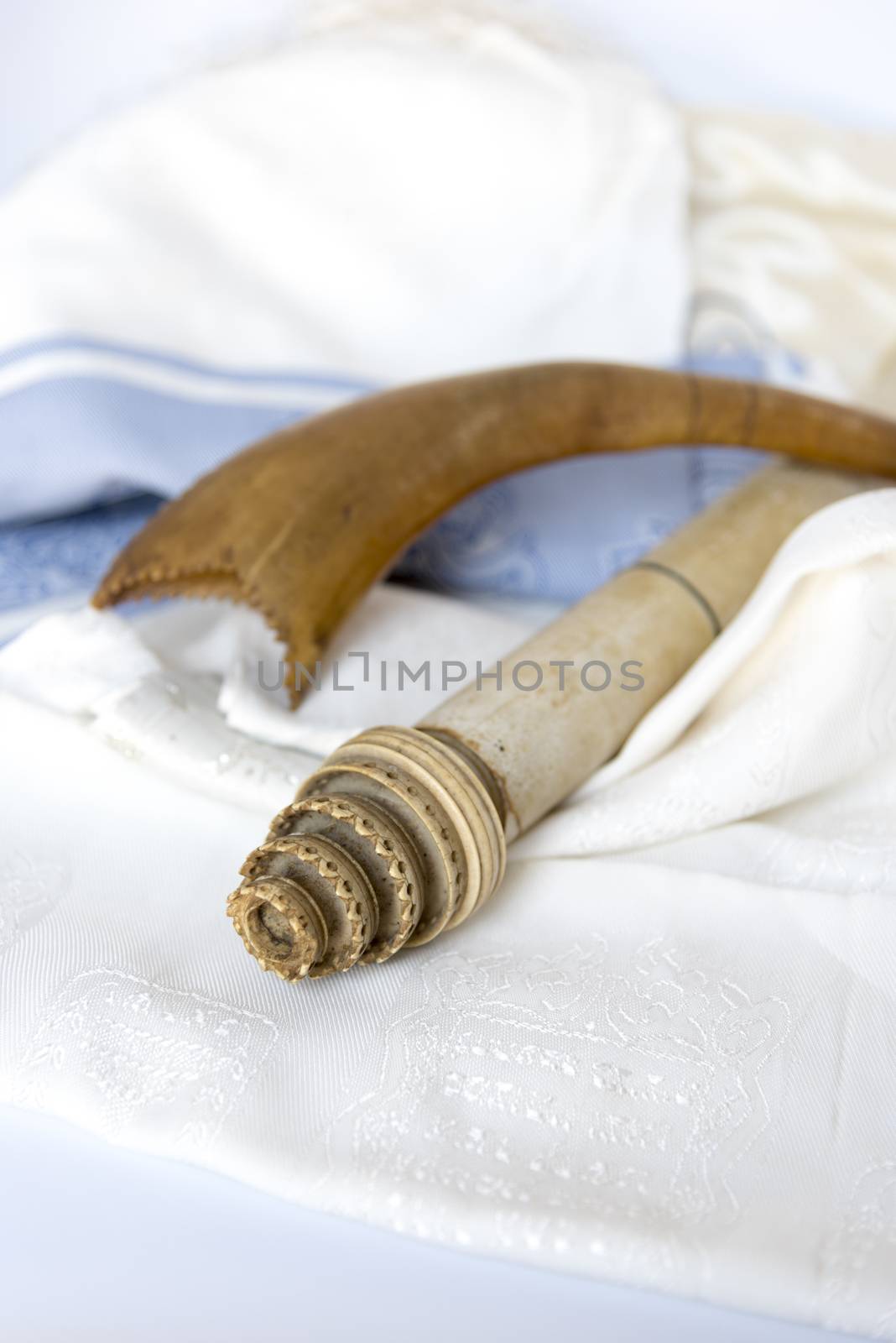 Rosh Hashanah Hashana jewish New Year holiday and Yom Kippur concept with Ram shofar horn ,Rolled Parchment Scroll, Tallit. High quality photo