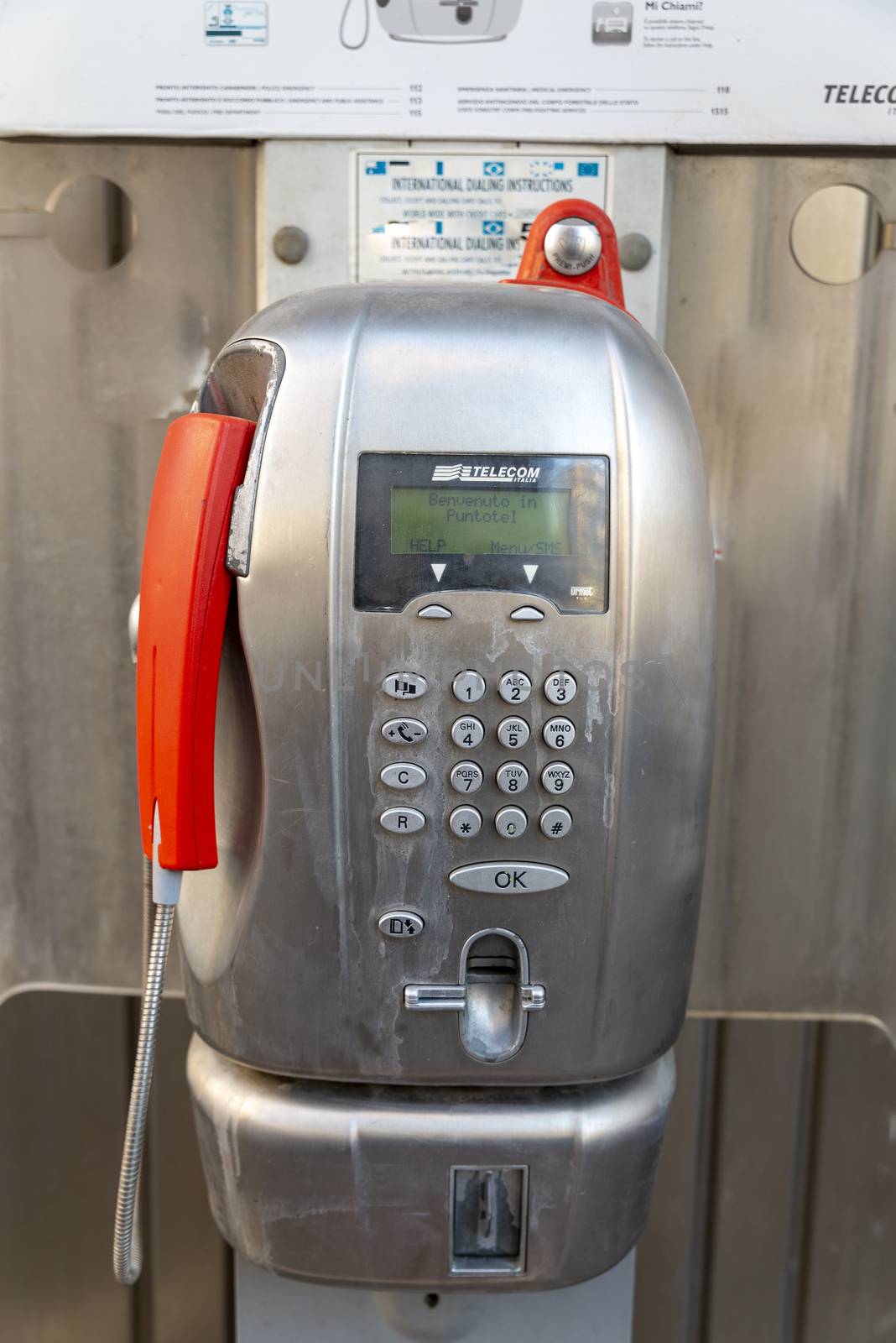 terni,italy august 08 2020:public telecom phone booth on a pedestal in the city