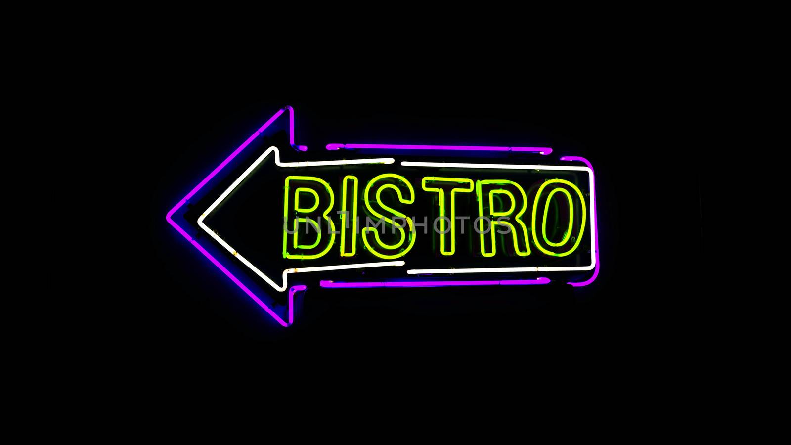 Bistro neon sign in night and black background.