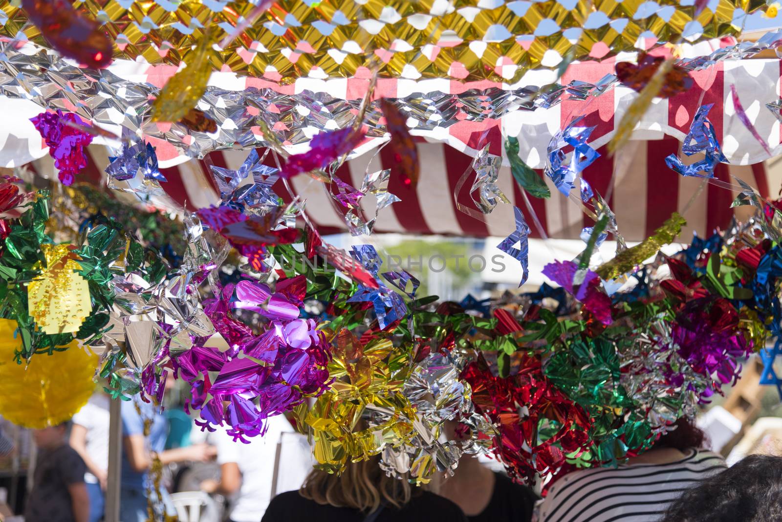 Colorful sukkah decorations. Sukkot four species festival. Shimmering decorations for party.