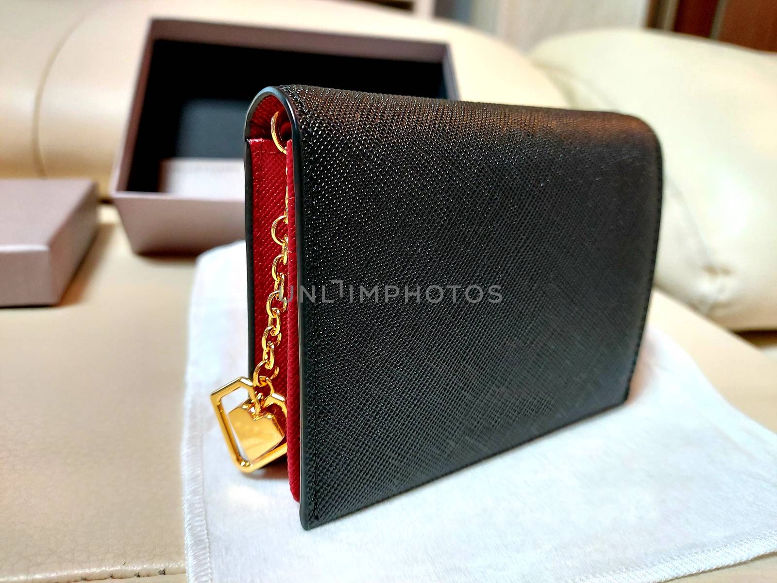 Black leather wallet on display by uphotopia