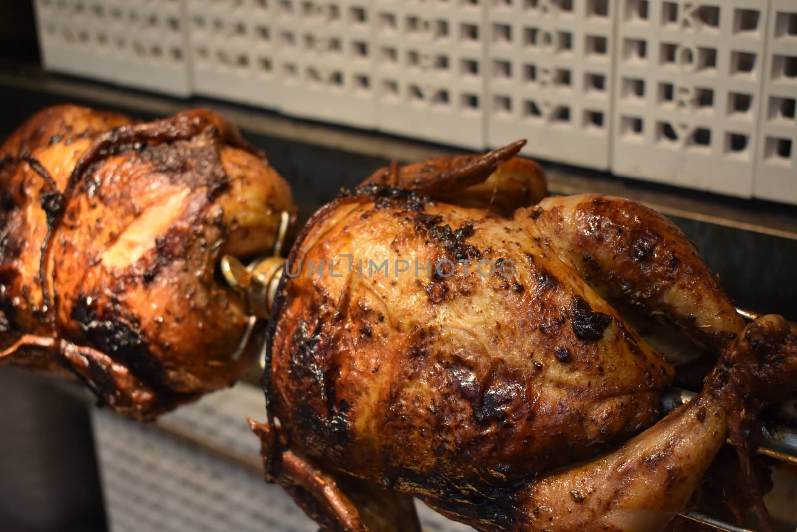 Fresh Cooked Rotisserie Chicken Still Inside the Rotisserie by bju12290