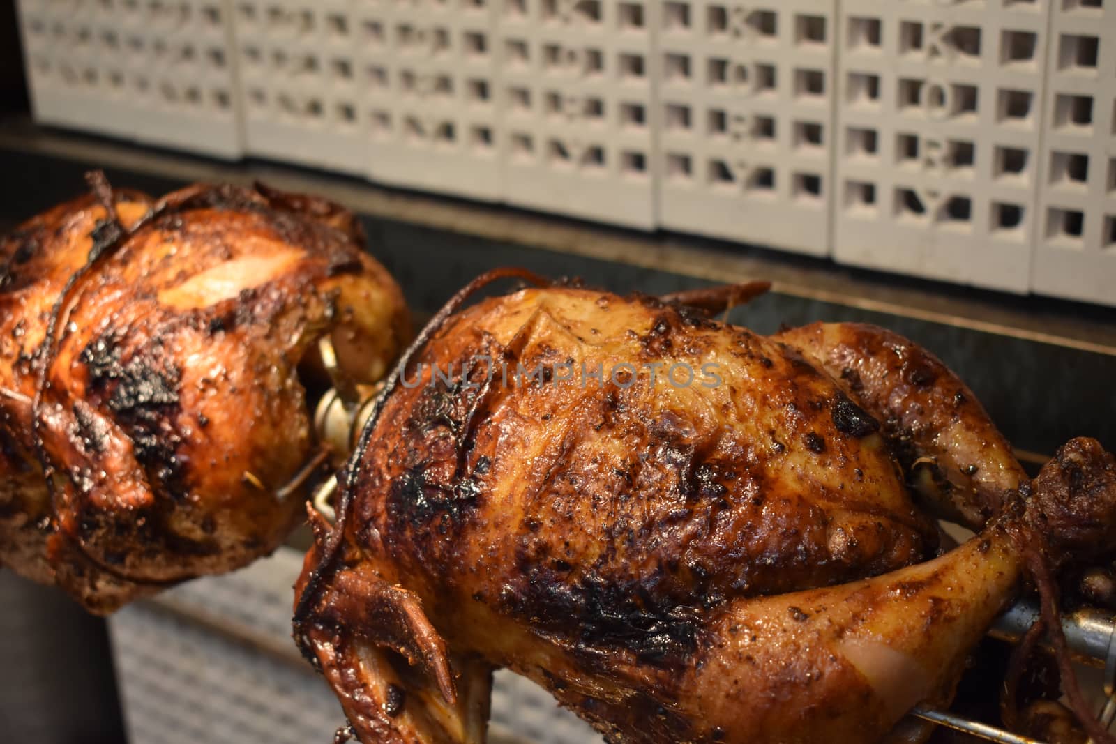 Fresh Cooked Rotisserie Chicken Still Rotating Inside the Rotisserie