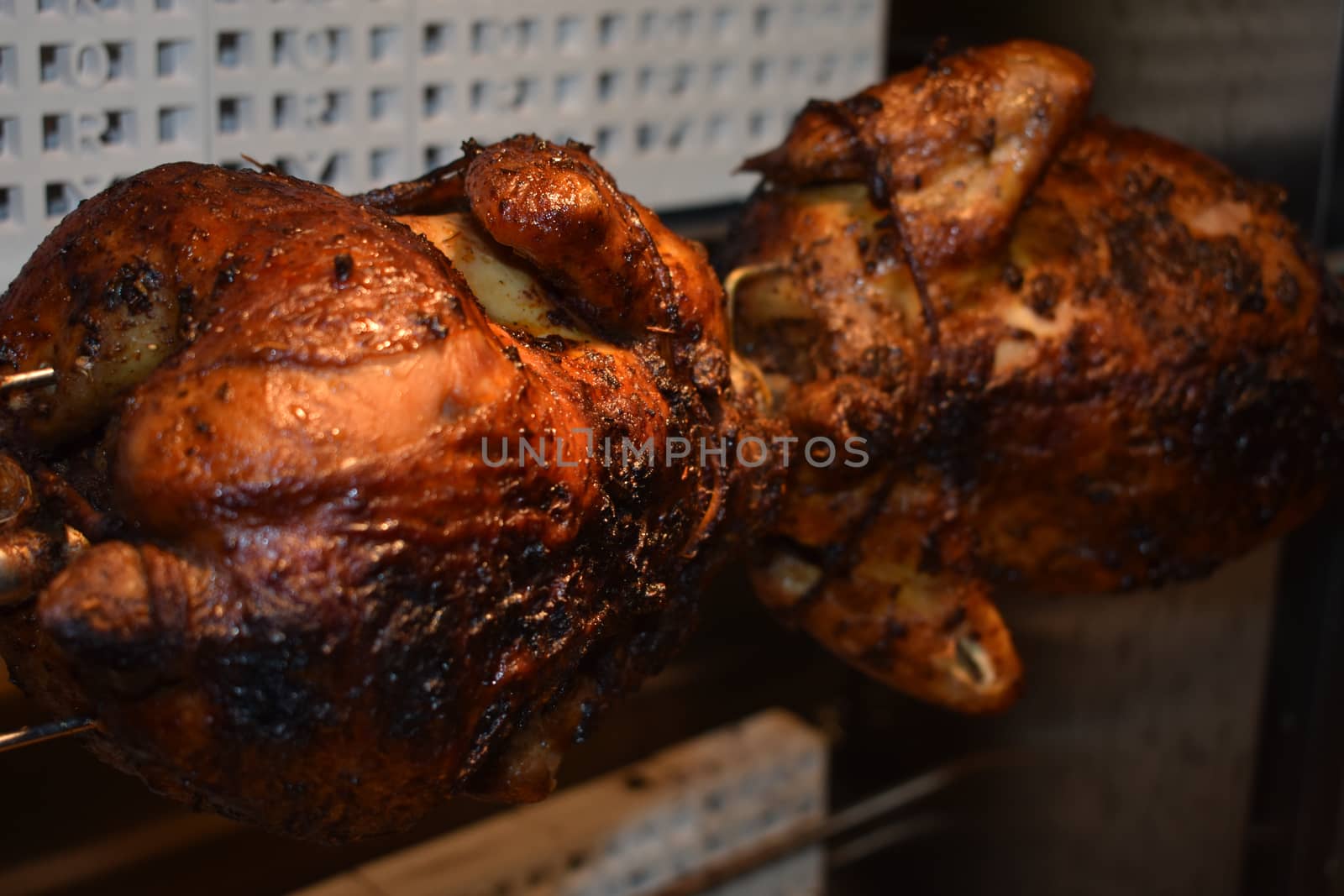 Fresh Cooked Rotisserie Chicken Still Inside the Rotisserie by bju12290