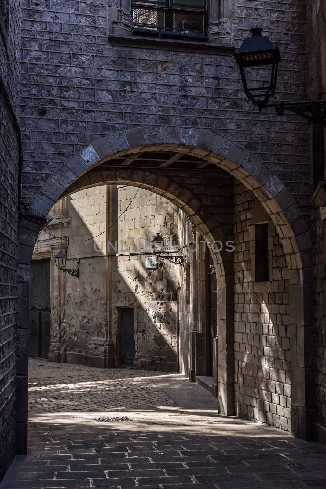 Entrance to place "Sant Felip Neri" in Barcelona of Spain by Digoarpi