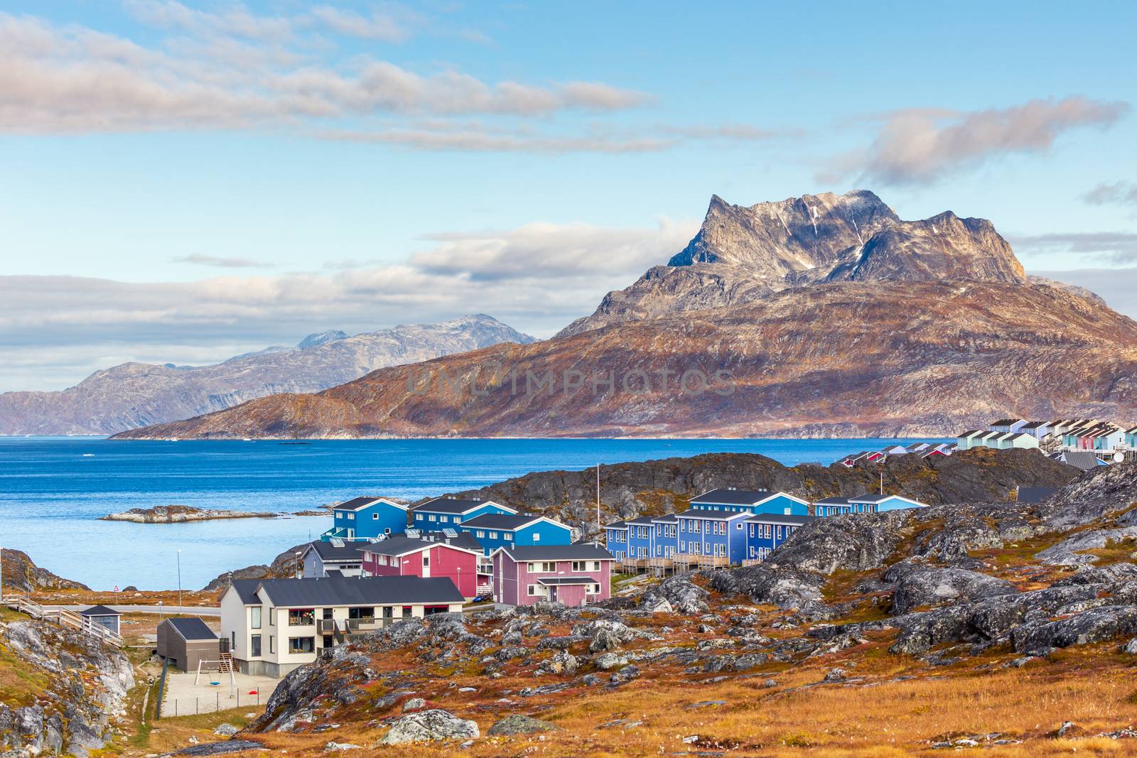 Inuit houses and cottages scattered across tundra landscape in r by ambeon