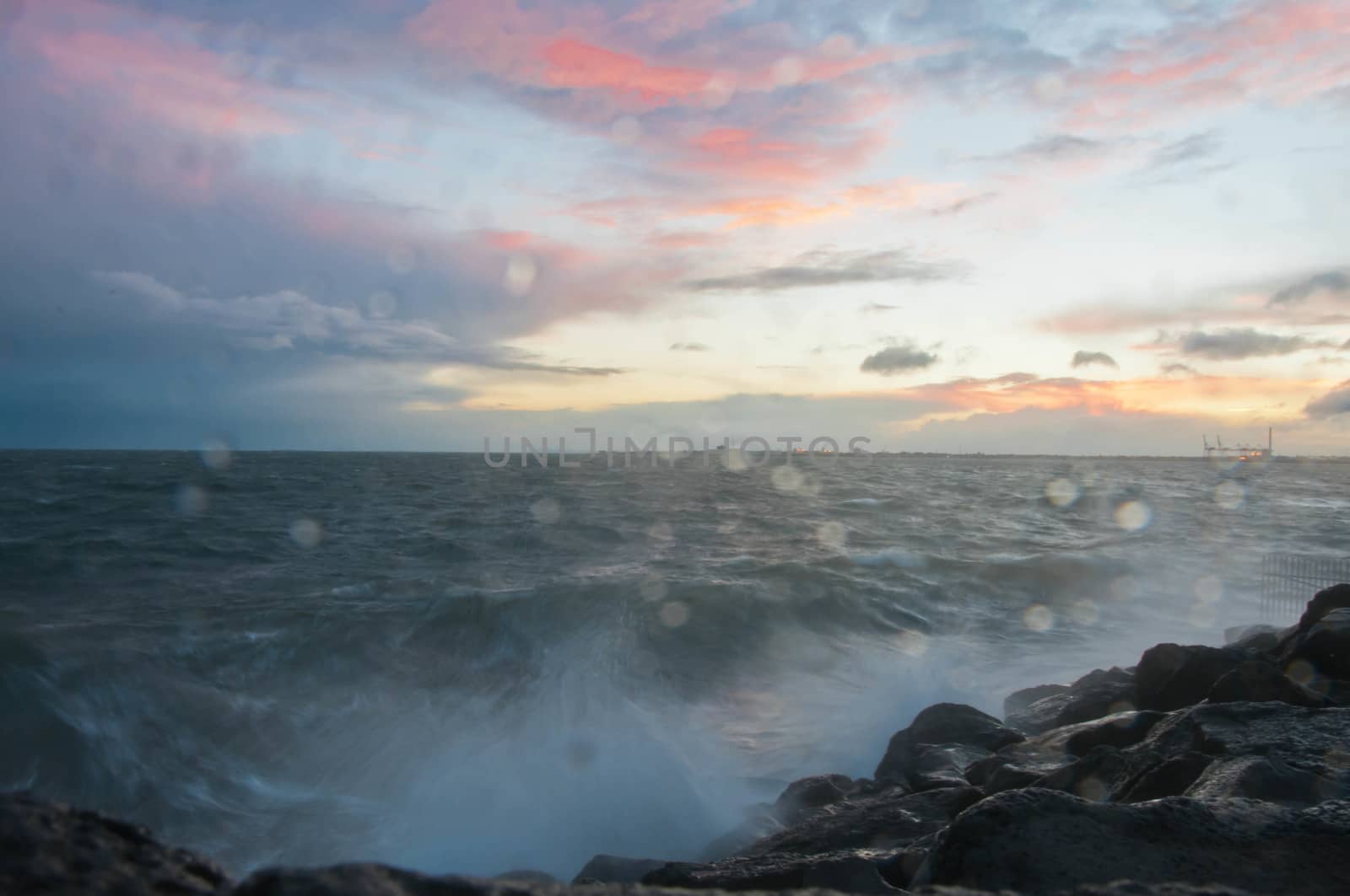 Dramatic splashing ocean wave in the evening with twilight sky i by eyeofpaul