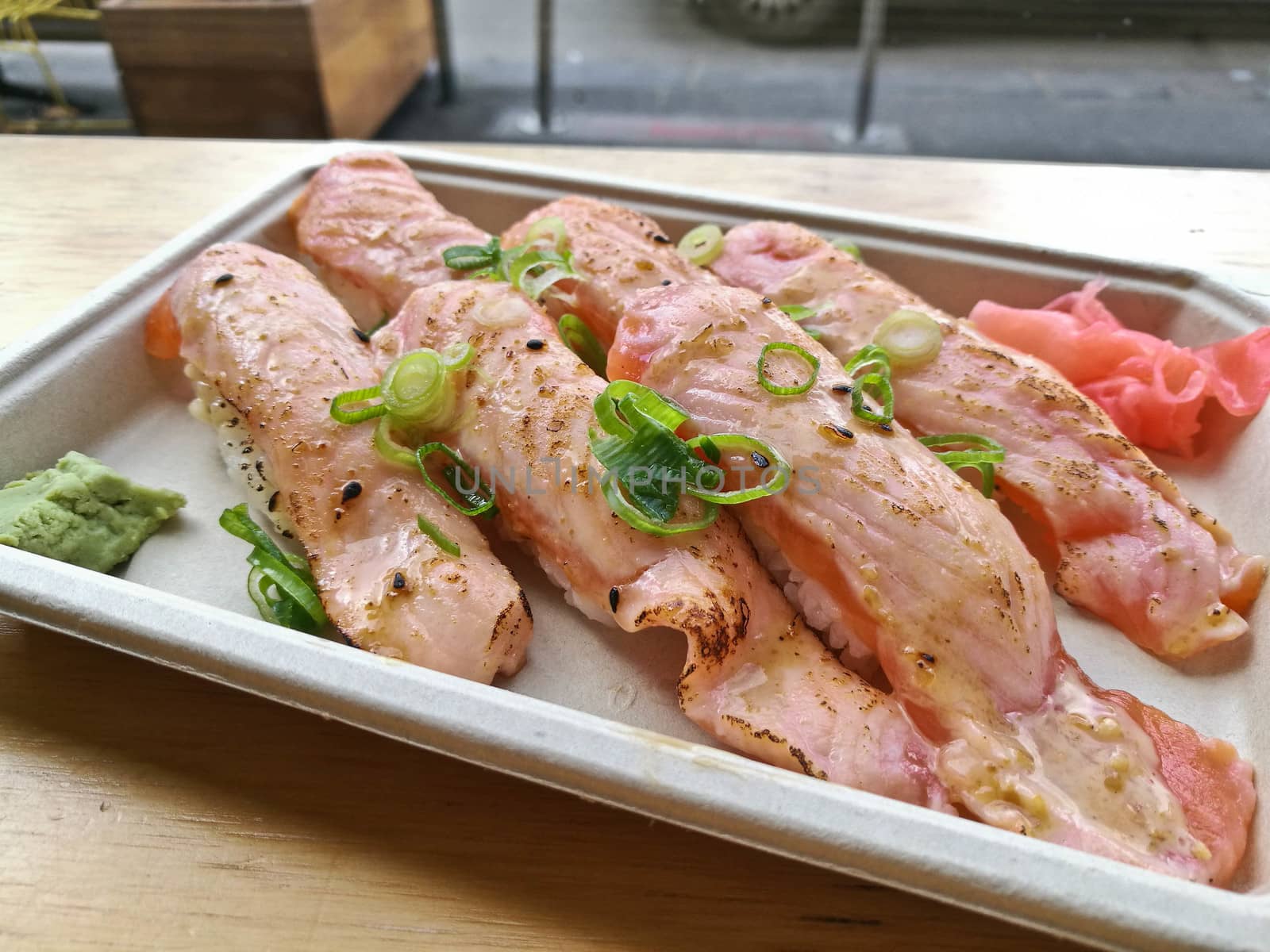 Aburi slightly grilled fatty salmon belly nigiri sushi by eyeofpaul