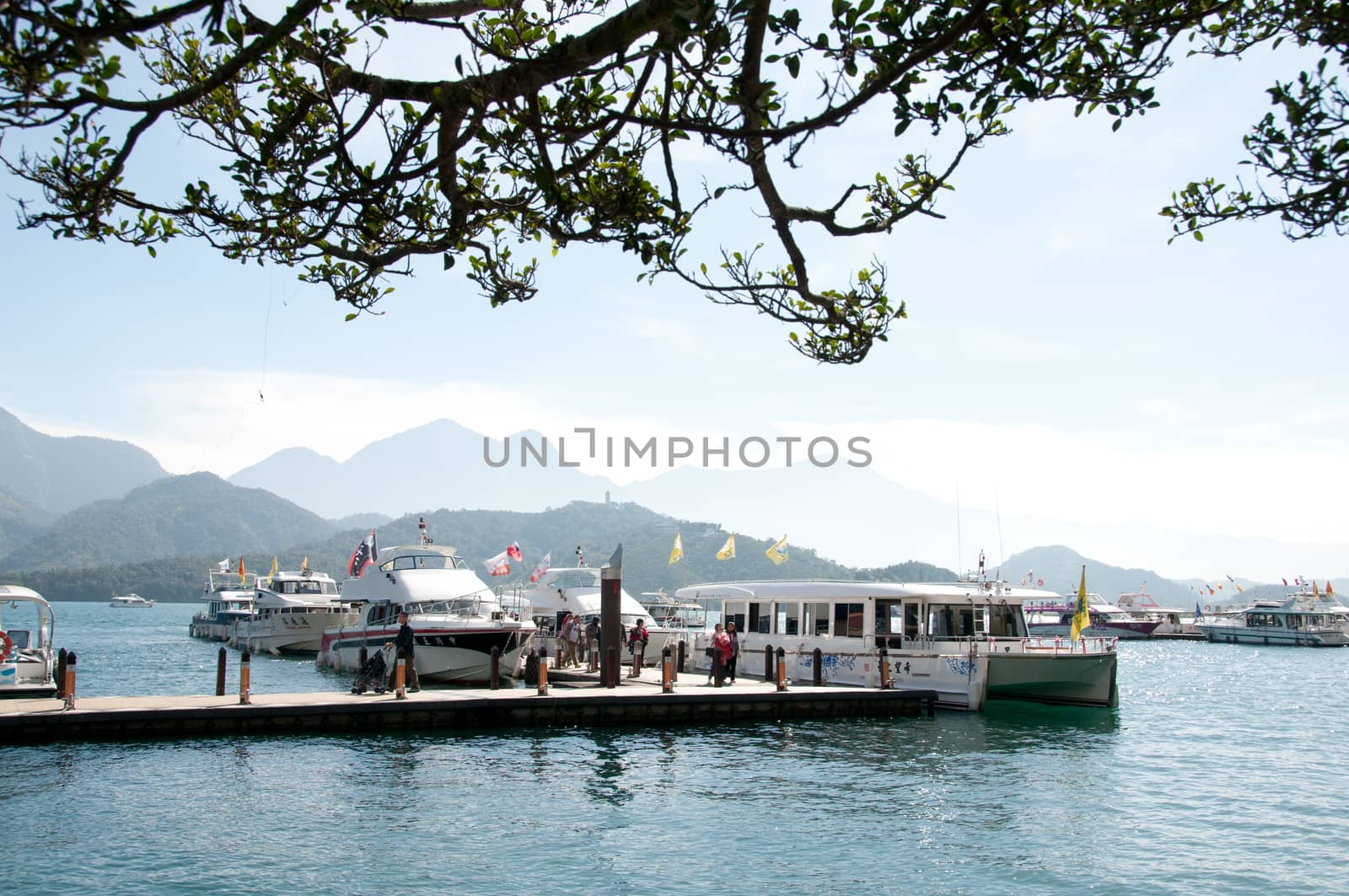 Tourists boarding ship at Sun Moon Lake Taiwan by eyeofpaul
