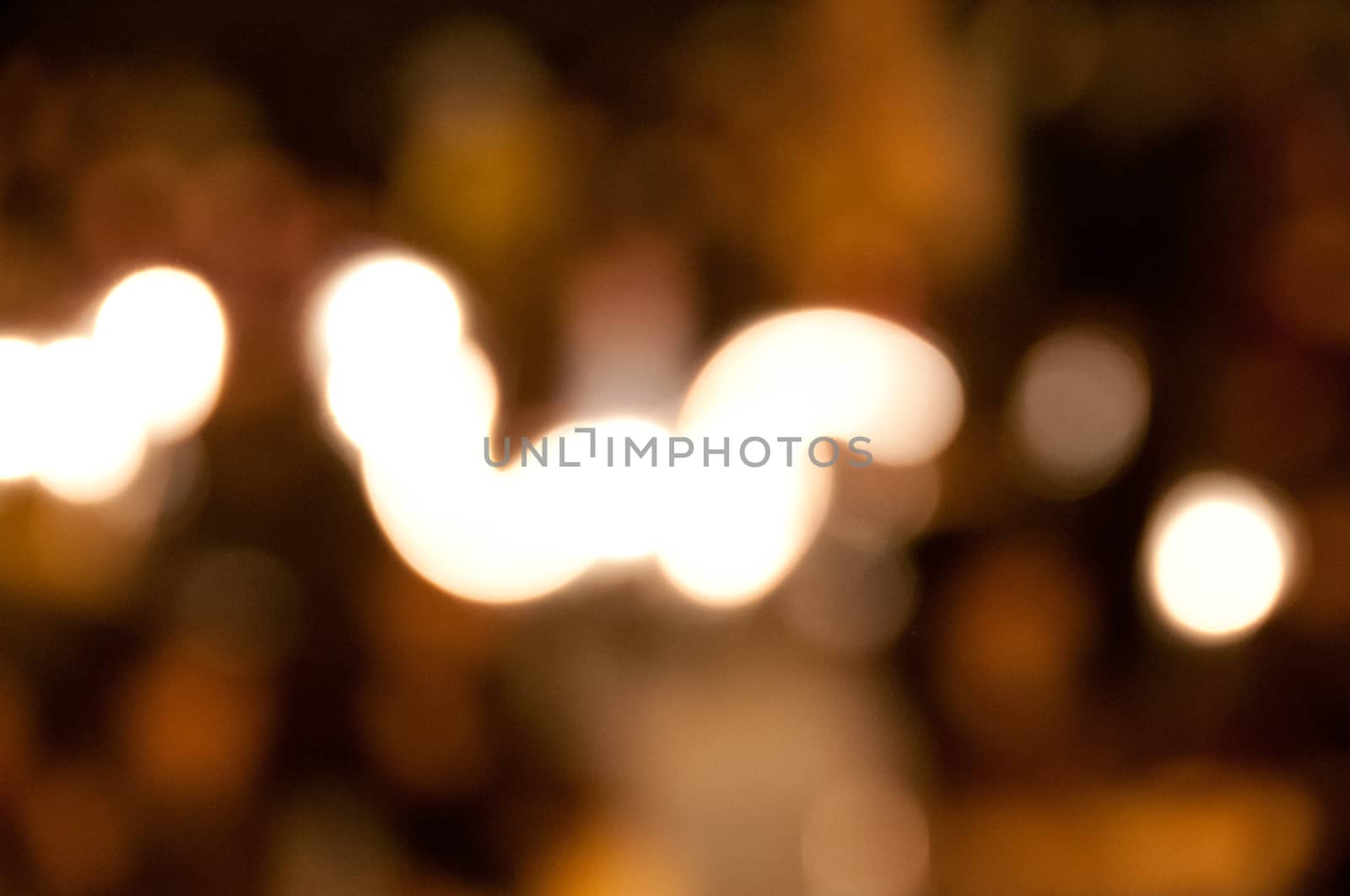 Defocused light bokeh glitter background by eyeofpaul