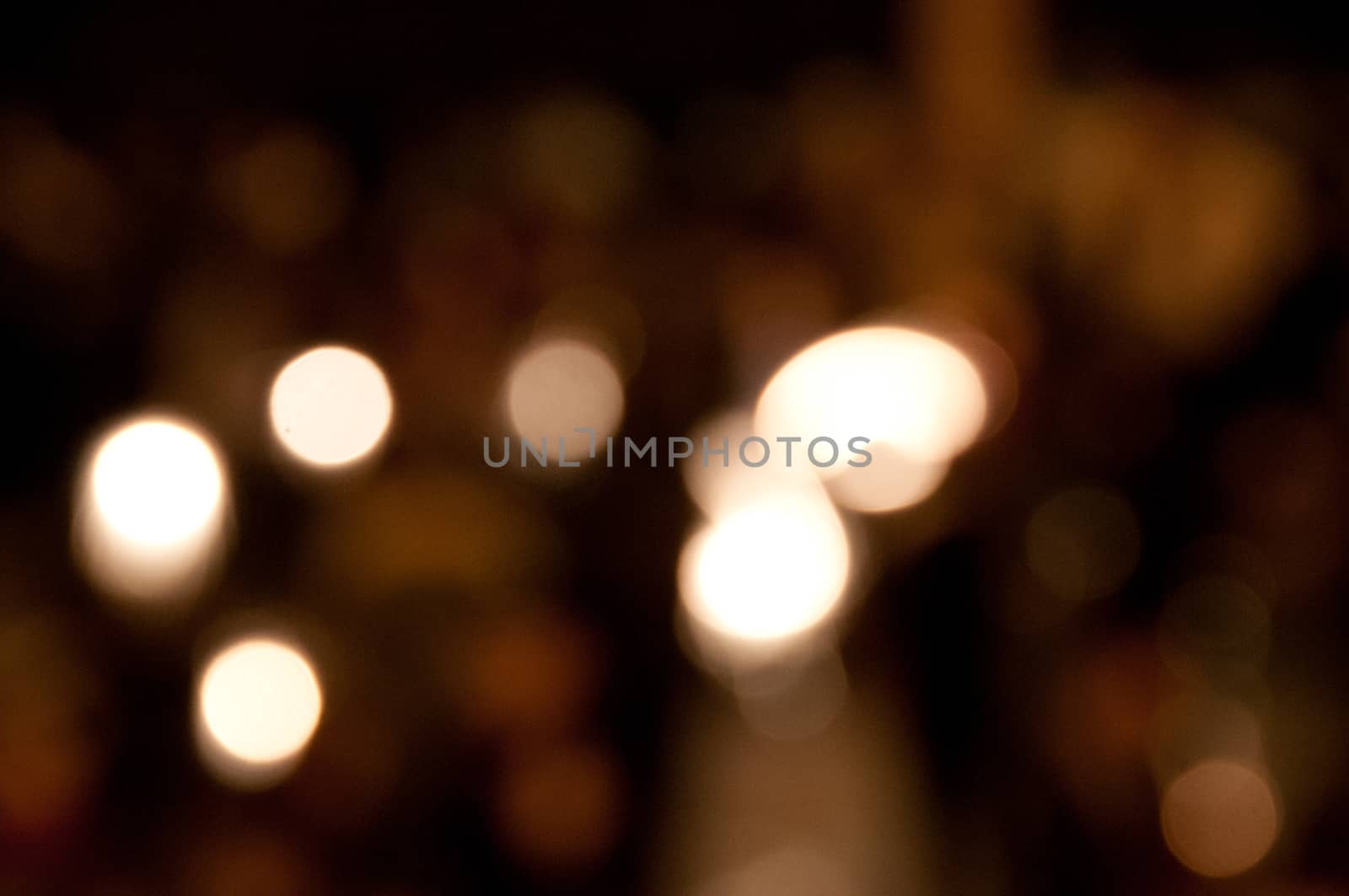 Defocused light yellow bokeh festive background