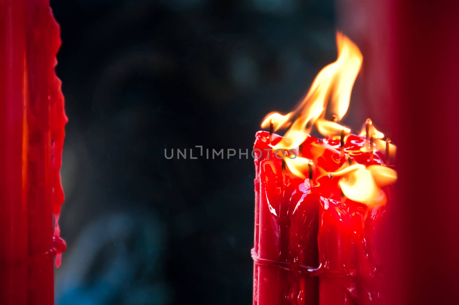 Group of bright red light candles melting by eyeofpaul