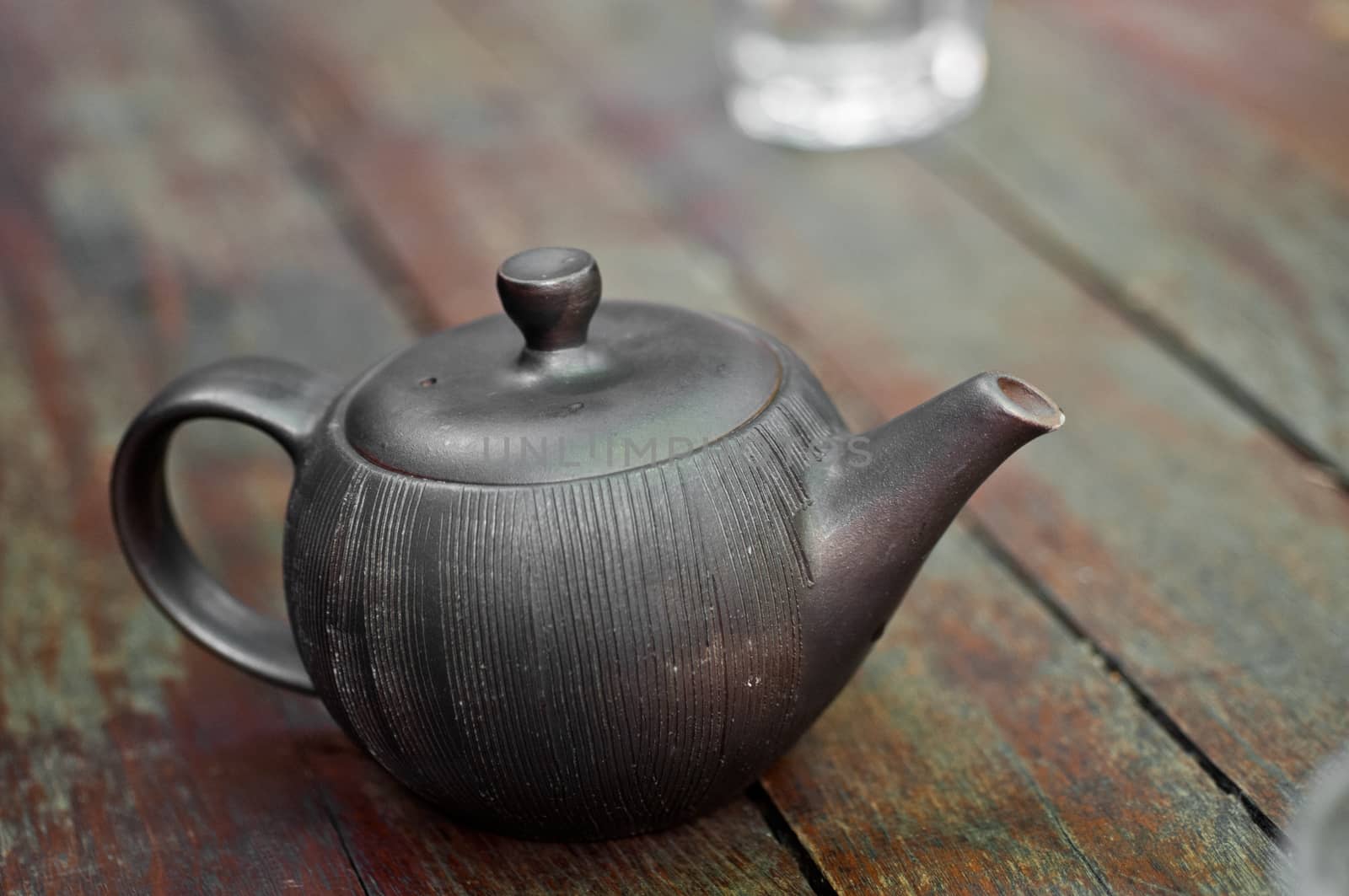 Traditional Chinese tea pot on wooden table