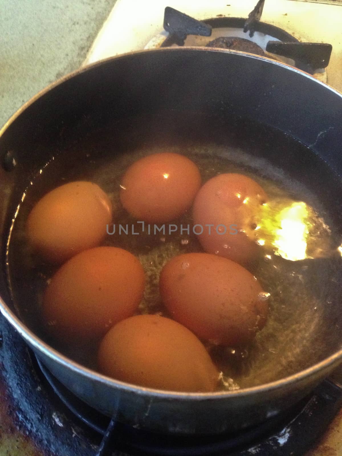 Eggs boiling in a pot