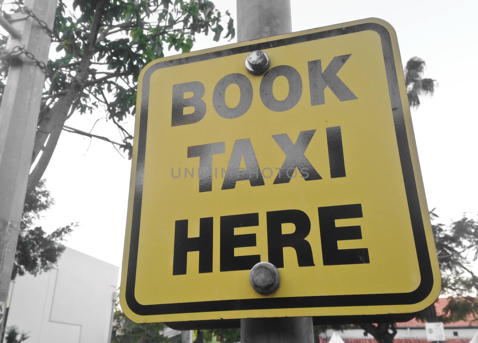 Book Taxi here yellow sign by eyeofpaul